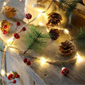 Battery Operated LED Christmas Garland Lights with Warm White Micro Bulbs and Pine Cones - Image 1