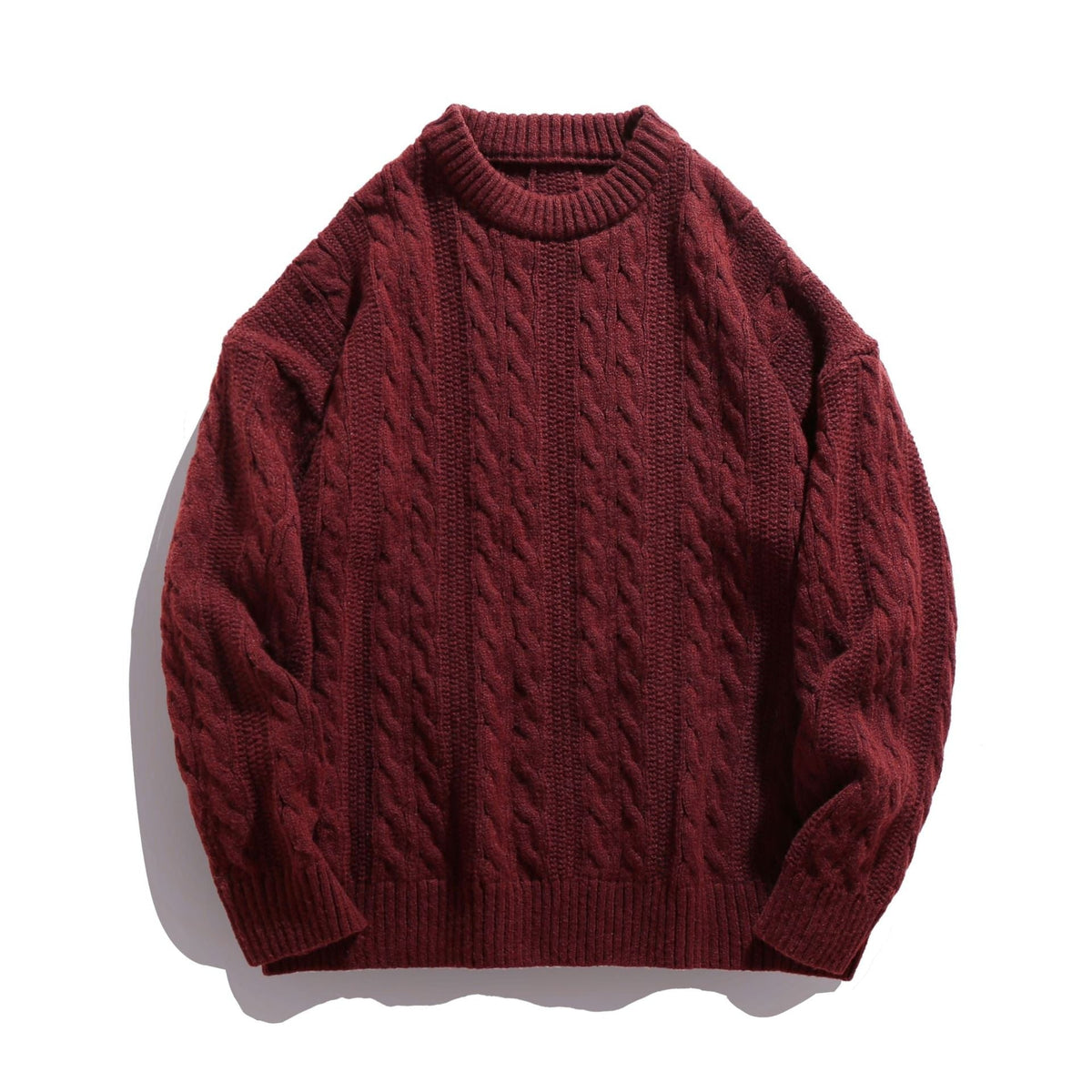 Le pull torsadé à col rond