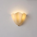 Wall Sconce with Wavy Glass Shade and Warm Ambient Lighting - Image 28