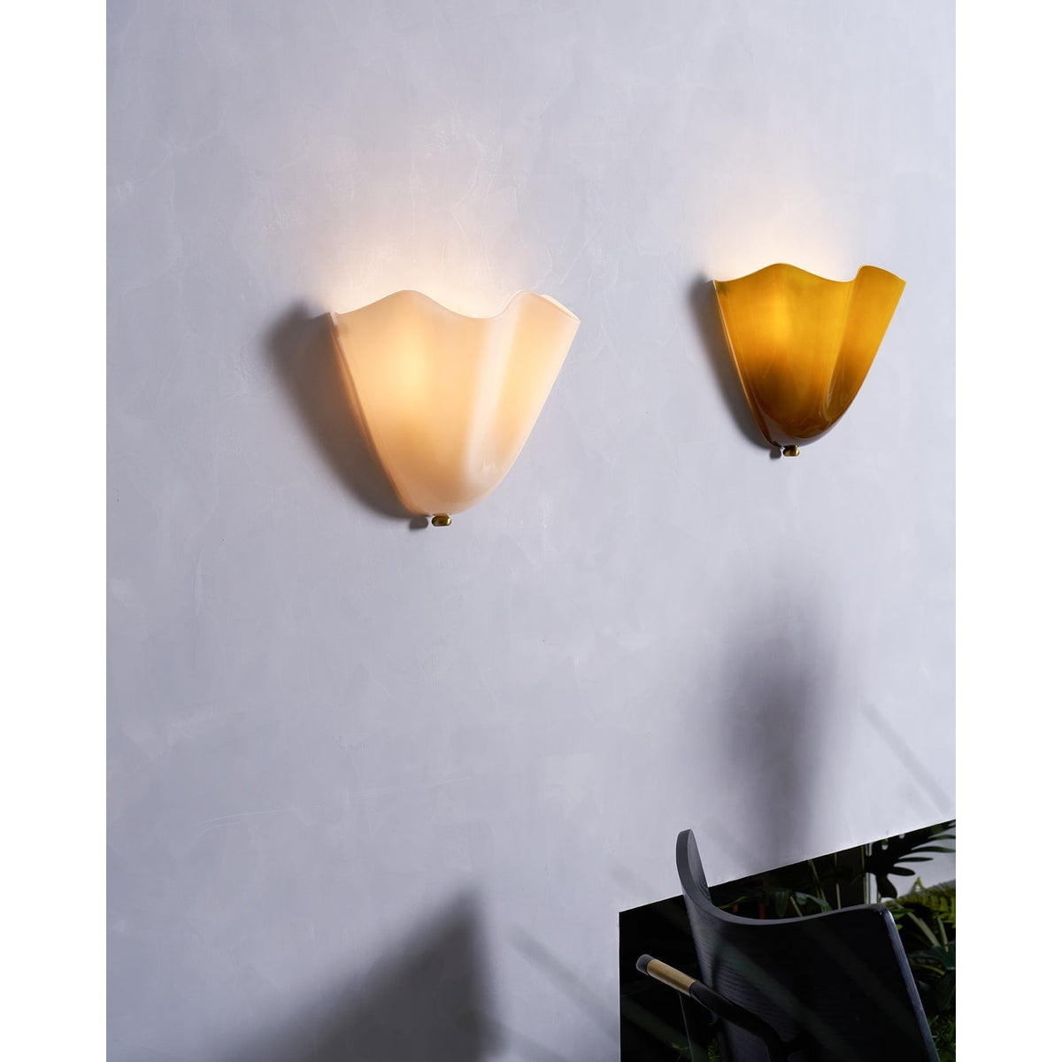 Wall Sconce with Wavy Glass Shade and Warm Ambient Lighting - Image 46