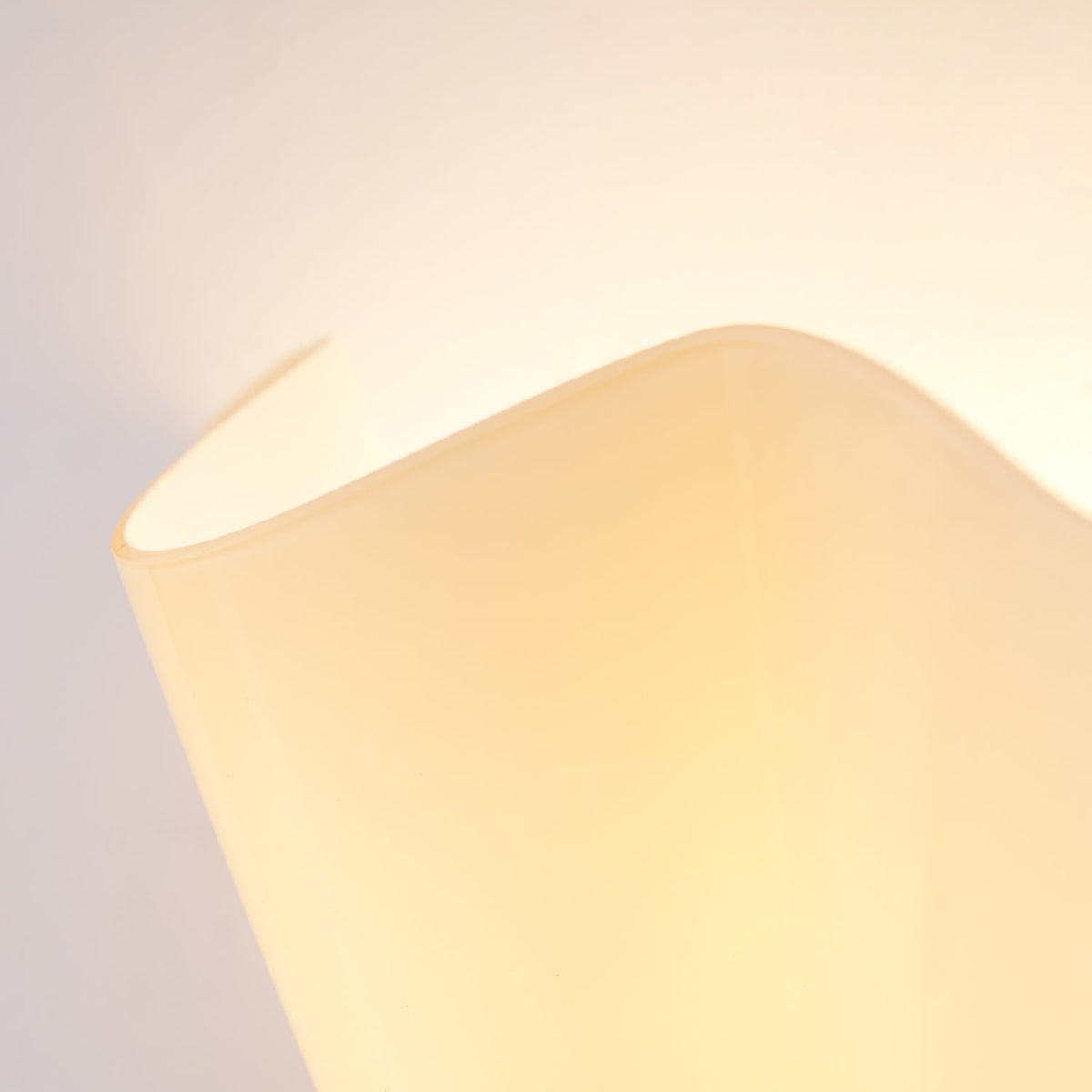Wall Sconce with Wavy Glass Shade and Warm Ambient Lighting - Image 53